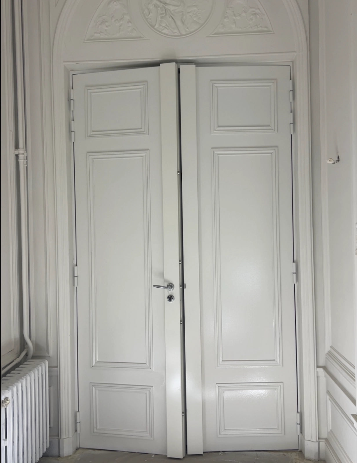 blindage de porte double vantaux molurée de l'interieur posée a Paris appartement haussmannien